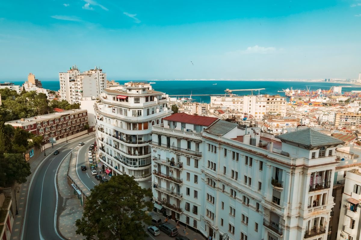 A view across the white buildings of Algiers towards the port and the Mediterranean